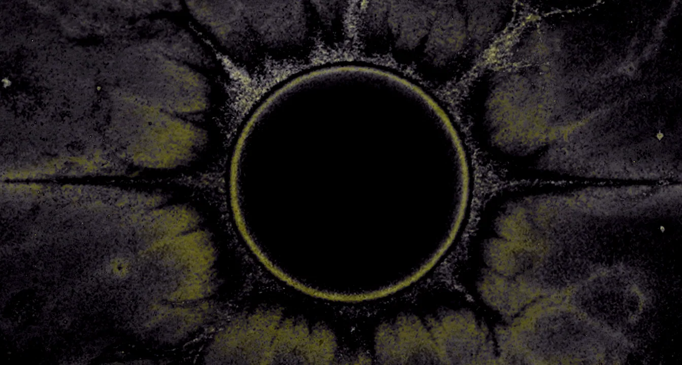 Theril, the devouring moon, eclipsing the light of Zoodotis above a darkening land